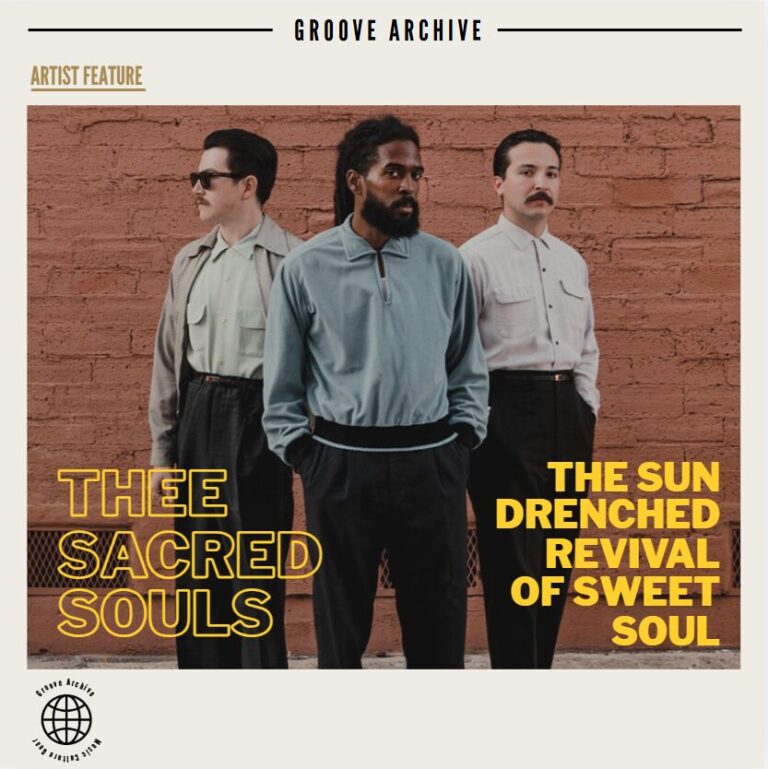 Thee Sacred Souls band members posing in vintage clothing in front of a red brick wall.