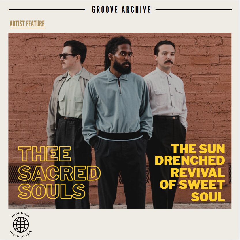 Thee Sacred Souls band members posing in vintage clothing in front of a red brick wall.